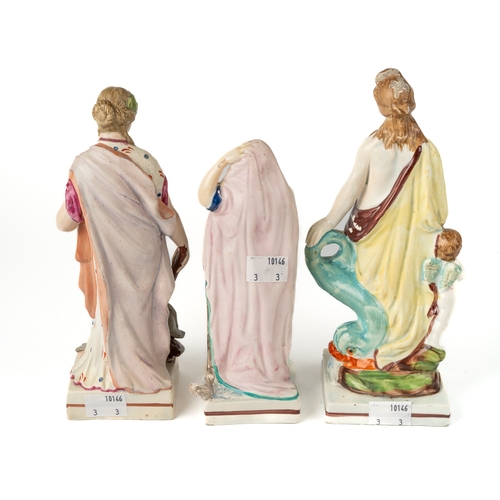 444 - A Staffordshire pearlware figure of Venus, standing beside Cupid and a dolphin, circa 1820, approx 2... 