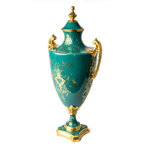 459 - A Lynton Porcelain pedestal vase and cover, of classical urn shape, decorated in bright enamels with... 