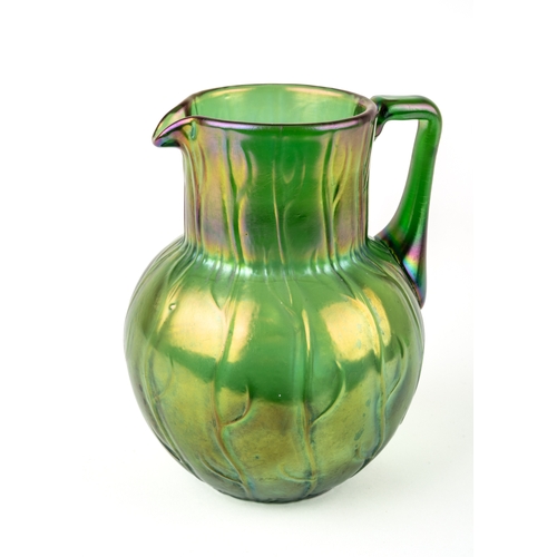 509 - An early 20th Century Loetz Neptune pattern green lustre water jug, the body relief molded with a st... 