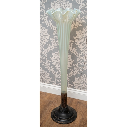 515 - An early 20th Century tapering cylindrical green and white vaseline long stem lily vase, on fitted w... 