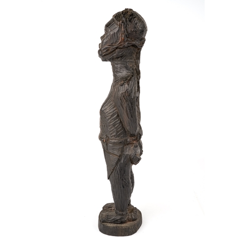 523 - An African carved wooden slave figure in chains and chocker , 37 cm.