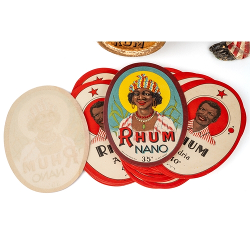 528 - Lemon Heart Rum bar advertising composite figure circa 1930 with a collection of rum bottle labels i... 