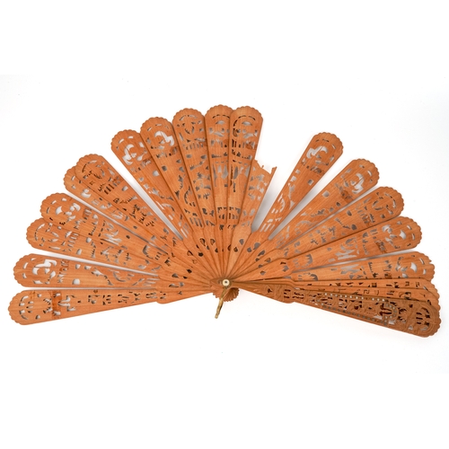 534 - An early Victorian Chinese carved wooden fan