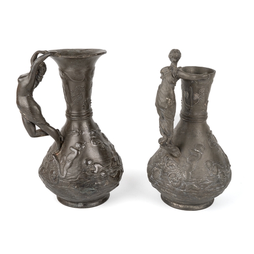 538 - Two Charles Theodore Perron pewter jugs with lady shaped handles, signed to base. Approx 22 cm tall