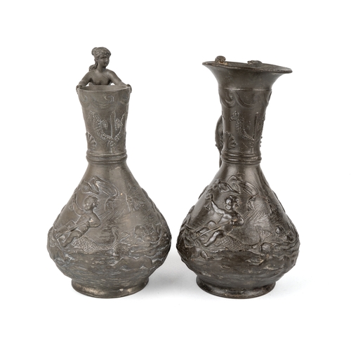 538 - Two Charles Theodore Perron pewter jugs with lady shaped handles, signed to base. Approx 22 cm tall