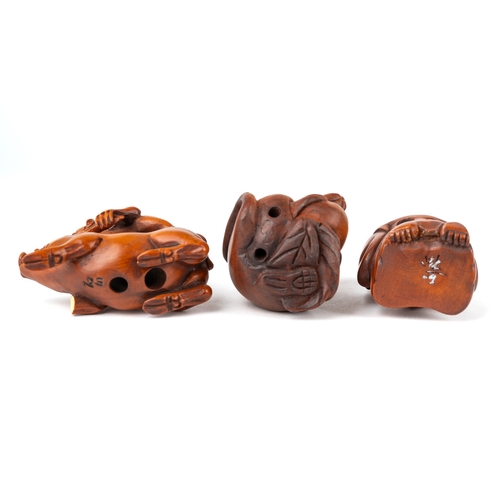 572 - Three Japanese carved netsuke - geisha, rat and a monkey riding a pig, 2 with signatures at base