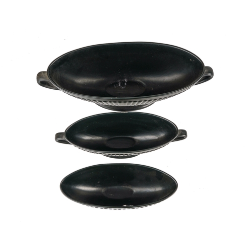 588 - Two Wedgwood black basalt twin-handled oval bowls, largest approx 32cm; and a bowl (3)