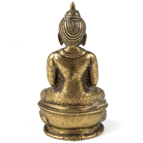 598 - A small bronze buddha devotional figure, 9.5 cm tall