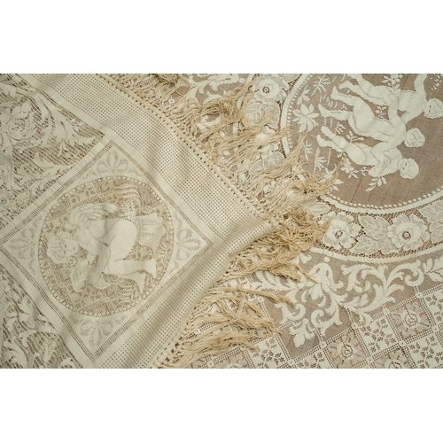 664 - A late 19th/early 20th Century lace bed spread /table cloth, the central section decorated with putt... 