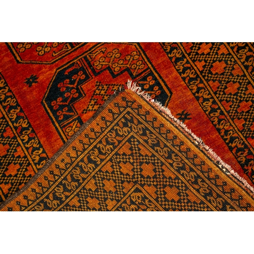 665 - An Afghan Old Gold rug with three 