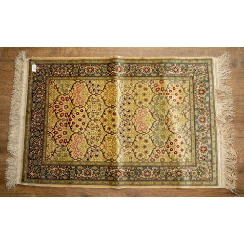 666 - A Persian City silk rug, gold ground, the centre with floral decoration within vignettes, geometric ... 