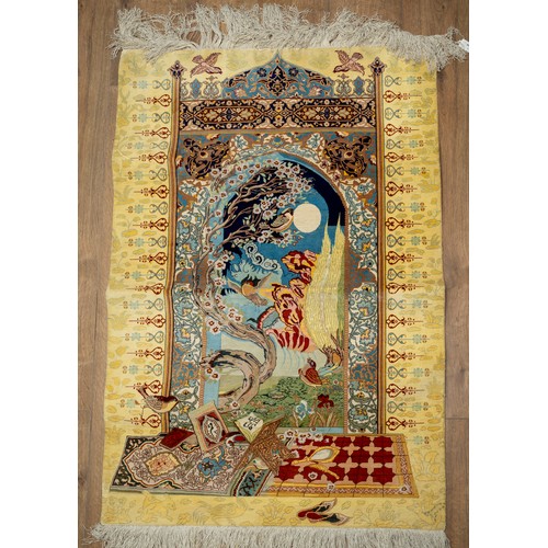 667 - A Persian pictorial praying rug, the centre depicts finches flying in a moonlit garden, the yellow b... 