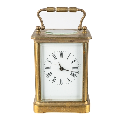 669 - A French brass eight-day carriage clock, with key