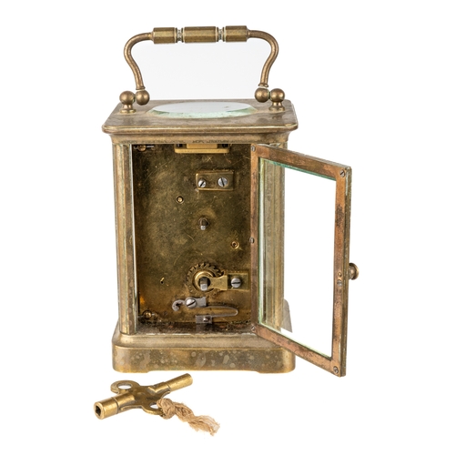 669 - A French brass eight-day carriage clock, with key