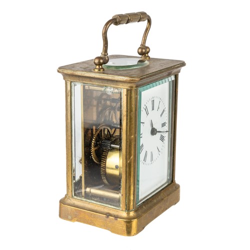 669 - A French brass eight-day carriage clock, with key