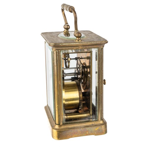 669 - A French brass eight-day carriage clock, with key