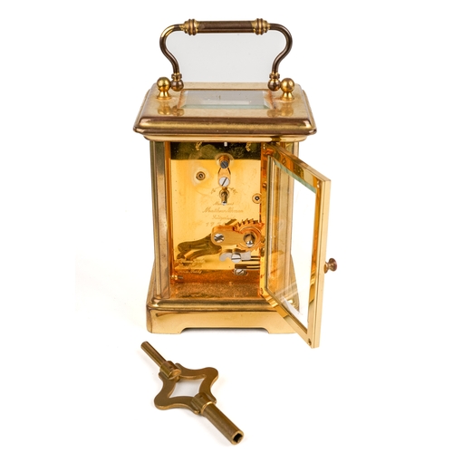 672 - A 20th century Swiss brass carriage clock by Matthew Norman, white enamel dial with Roman numerals, ... 