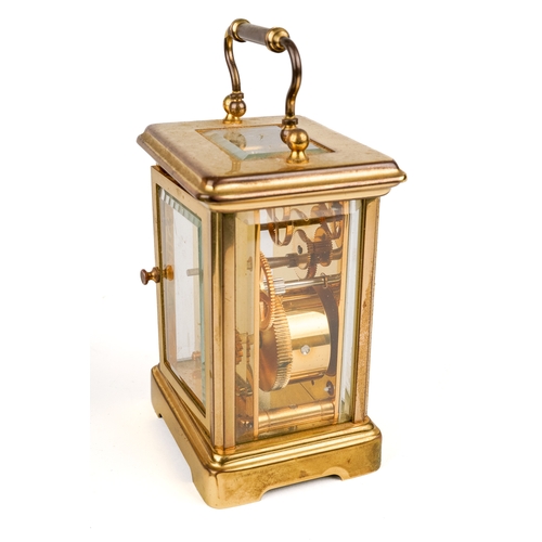 672 - A 20th century Swiss brass carriage clock by Matthew Norman, white enamel dial with Roman numerals, ... 