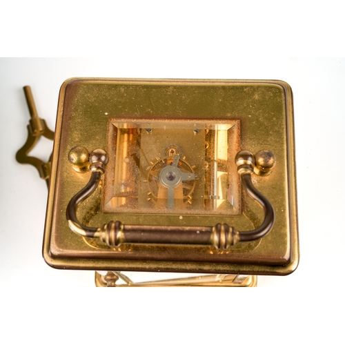 672 - A 20th century Swiss brass carriage clock by Matthew Norman, white enamel dial with Roman numerals, ... 