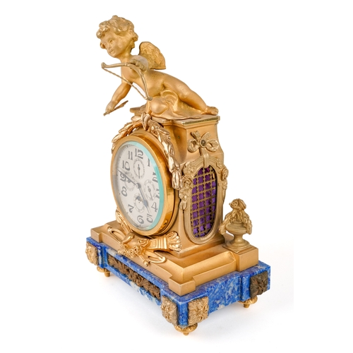 673 - A Swiss eight day calendar and moon phase time piece / clock, with ormolu cherub, Lapis Lazuli base,... 