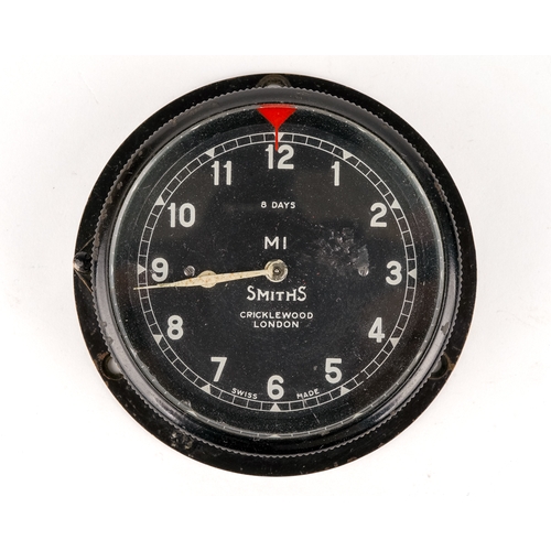 676 - A Smiths bezel wind car clock M1, black case, approx 7.3cm diameter