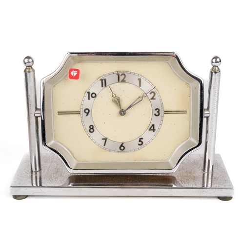 679 - A 30 hour chrome desk clock, on pivoted stand, approx 17cm wide x 11cm high