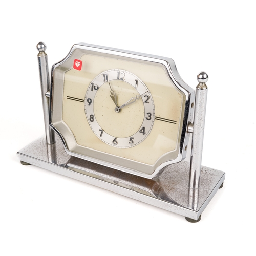 679 - A 30 hour chrome desk clock, on pivoted stand, approx 17cm wide x 11cm high