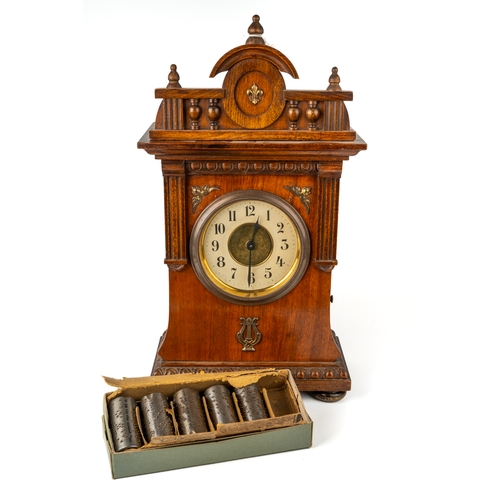 682 - A nursery alarm clock with musical cylinder time tune player, with cylinders, approx 41cm high