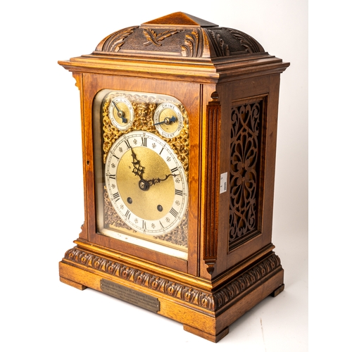 691 - An Edwardian bracket clock, in honey coloured oak, gilt metal detail to face, key to front and back ... 