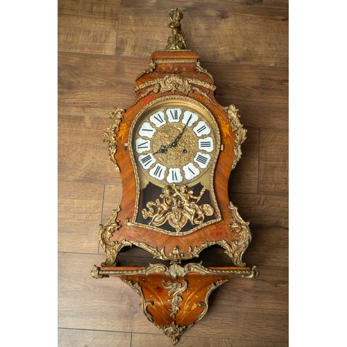 694 - An Italian marquetry boulle style bracket clock, with gilt bronze embellishments, complete with key ... 