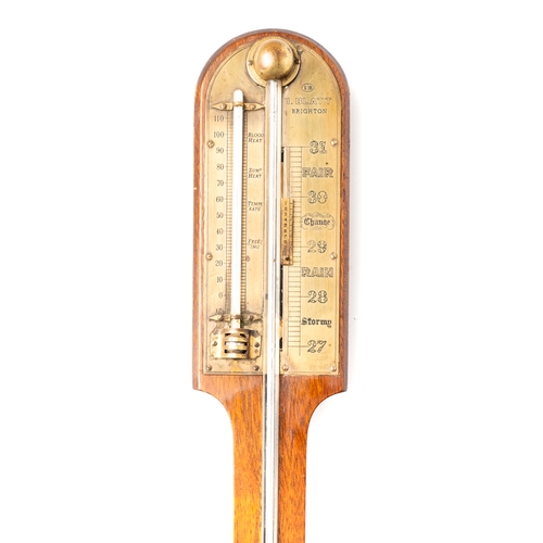 699 - A walnut stick barometer and thermometer, by I. Blatt of Brighton, with brass fittings, approx 88cm ... 