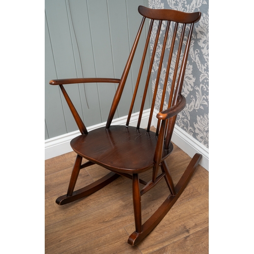 701 - An Ercol elm and beech Goldsmith rocking chair, 84 cm tall.