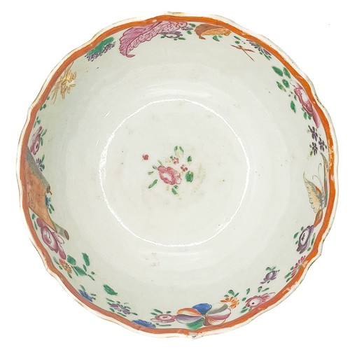 424 - A Chinese famille rose bowl, wavy rim, enamelled with flowers and foliage, approx 14cm diam, 7cm hig... 