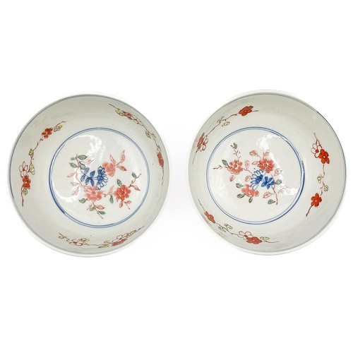 421 - A pair of Chinese bowls, decorated with animals amongst foliage, the inner bowls painted with flower... 