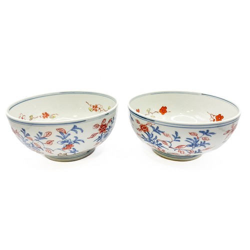 421 - A pair of Chinese bowls, decorated with animals amongst foliage, the inner bowls painted with flower... 