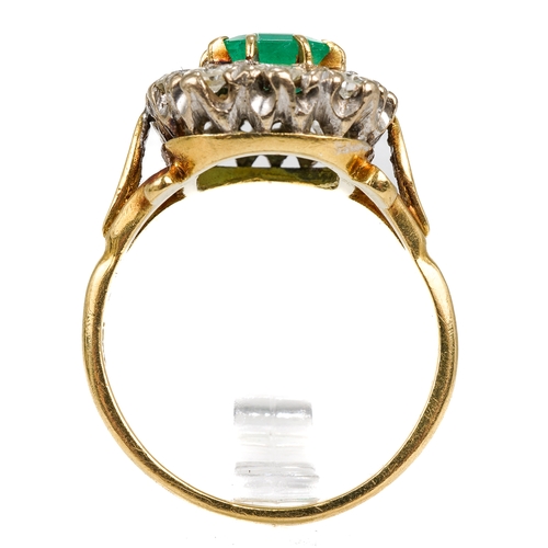 9 - An 18ct yellow gold emerald and diamond cluster ring, the step-cut emerald surrounded by ten round d... 