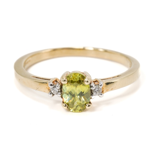 19 - A 9ct yellow gold peridot and diamond ring, the oval mixed-cut peridot approx 6mm x 4mm, size N1/2, ... 