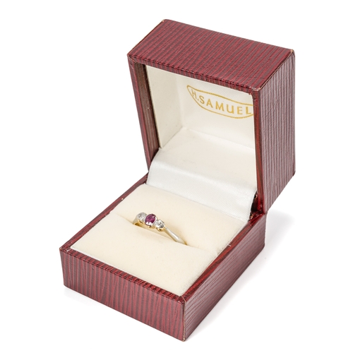 21 - An 18ct yellow gold ruby and diamond three-stone ring, the oval mixed-cut ruby flanked by diamond ch... 