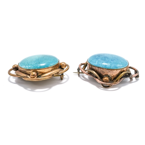 28 - Two early 20th Century Ruskin cabochon brooches, in gilt metal mounts, stamped to reverse 'RUSKIN', ... 