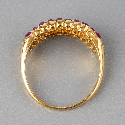 31 - A yellow gold ruby and diamond ring, set with old-cut diamonds flanked by two rows of mixed-cut rubi... 