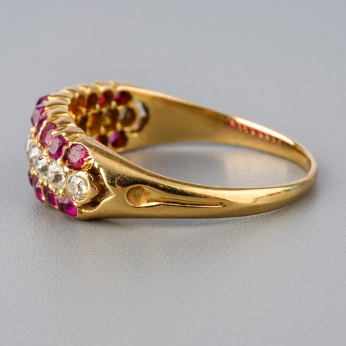 31 - A yellow gold ruby and diamond ring, set with old-cut diamonds flanked by two rows of mixed-cut rubi... 