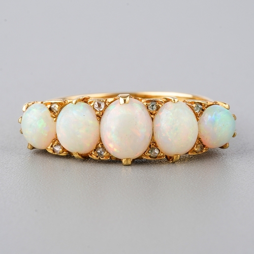 32 - An 18ct yellow gold opal five-stone ring, set with graduated cabochon opals, diamond highlights, siz... 