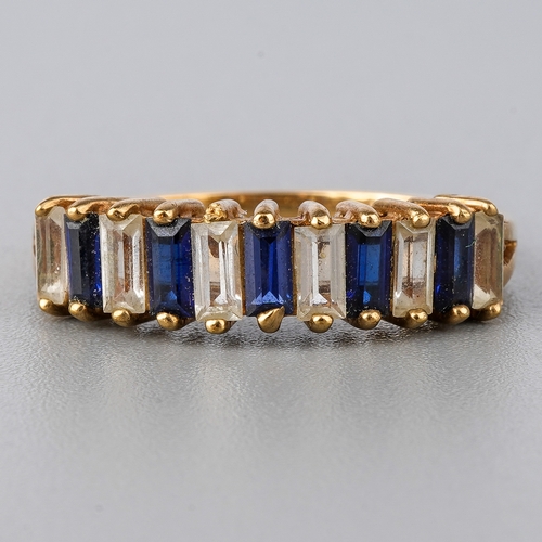 33 - A 9ct yellow gold ring, set with alternating blue and white stones possibly spinel, size O, total gr... 