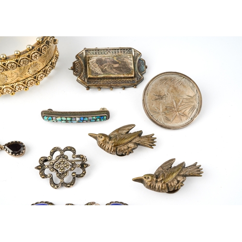 35 - A collection of silver jewellery including a Victorian silver gilt hinged bangle, two Aesthetic move... 