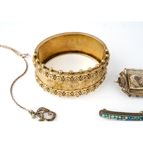 35 - A collection of silver jewellery including a Victorian silver gilt hinged bangle, two Aesthetic move... 