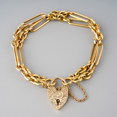 39 - An 18ct yellow gold bracelet, converted from a watch chain, with a 9ct gold padlock clasp, total gro... 