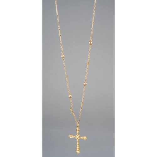 56 - A 15ct yellow gold and seed pearl cross pendant, stamped '15', on a 9ct yellow gold fancy link chain... 