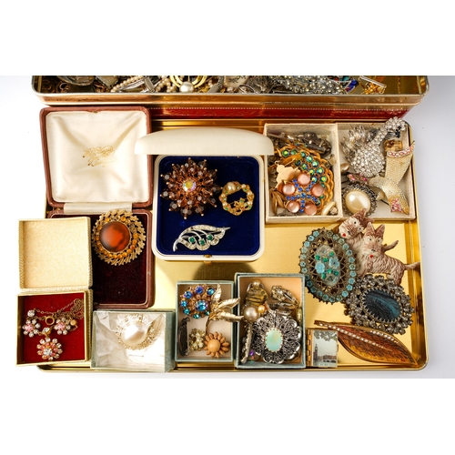 62 - A large quantity of costume jewellery including a Butler and Wilson style swan brooch; Hollywood bro... 