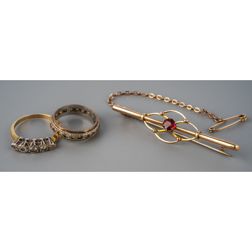 68 - An Edwardian 9ct yellow gold bar brooch, set with a ruby, steel hinged pin, total gross weight appro... 