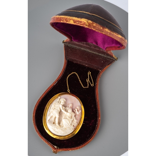 69 - A 19th century conch shell cameo brooch, carved depicting a Roman soldier and figures, in a 9ct yell... 